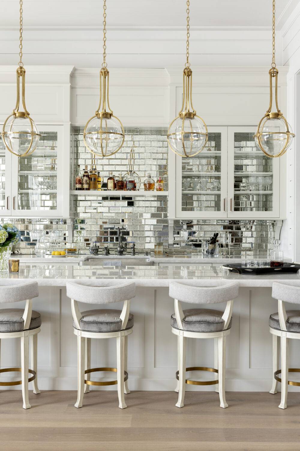 Close-up of bar featuring Antique Mirror Bevel tile. 