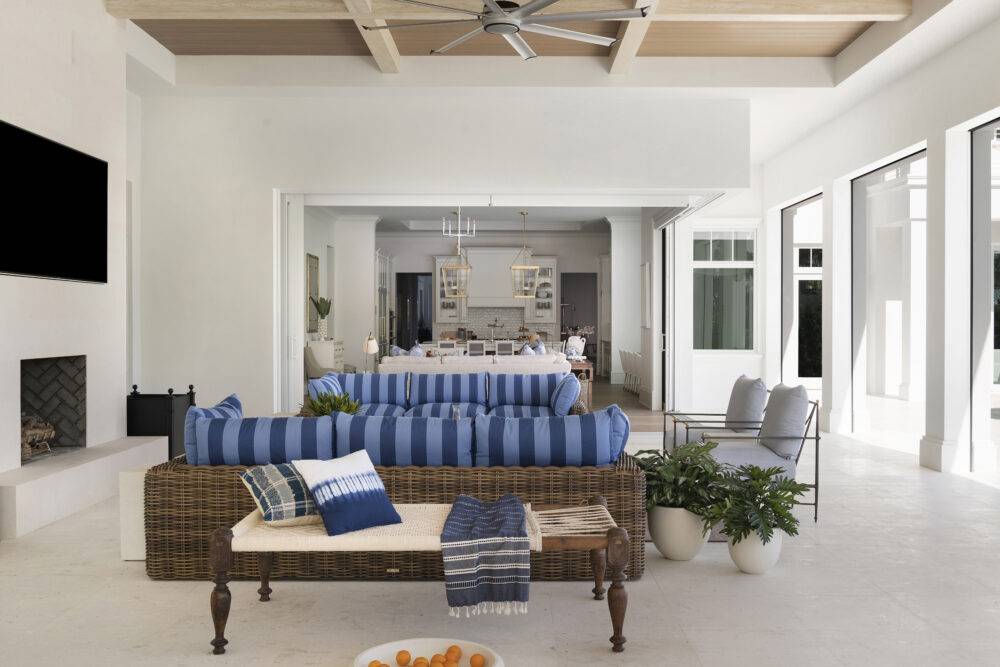 Living area with seating and fireplace featuring Siberian Pearl Brushed tile. 