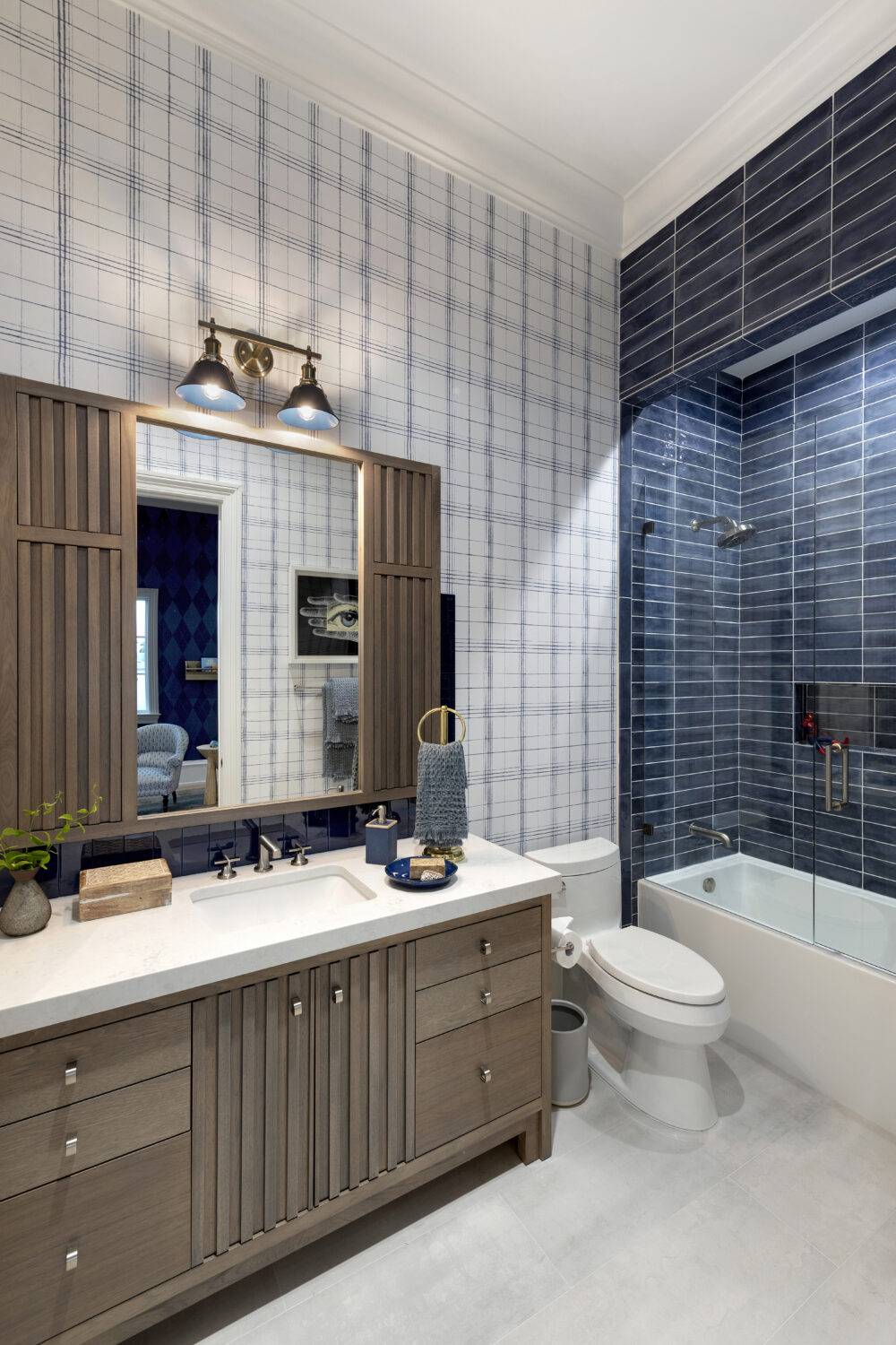 Boys' blue bathroom featuring Ionic White, Splendours Blue Night, Splendours Blue Night trim and Glass Nautical Blue tile.