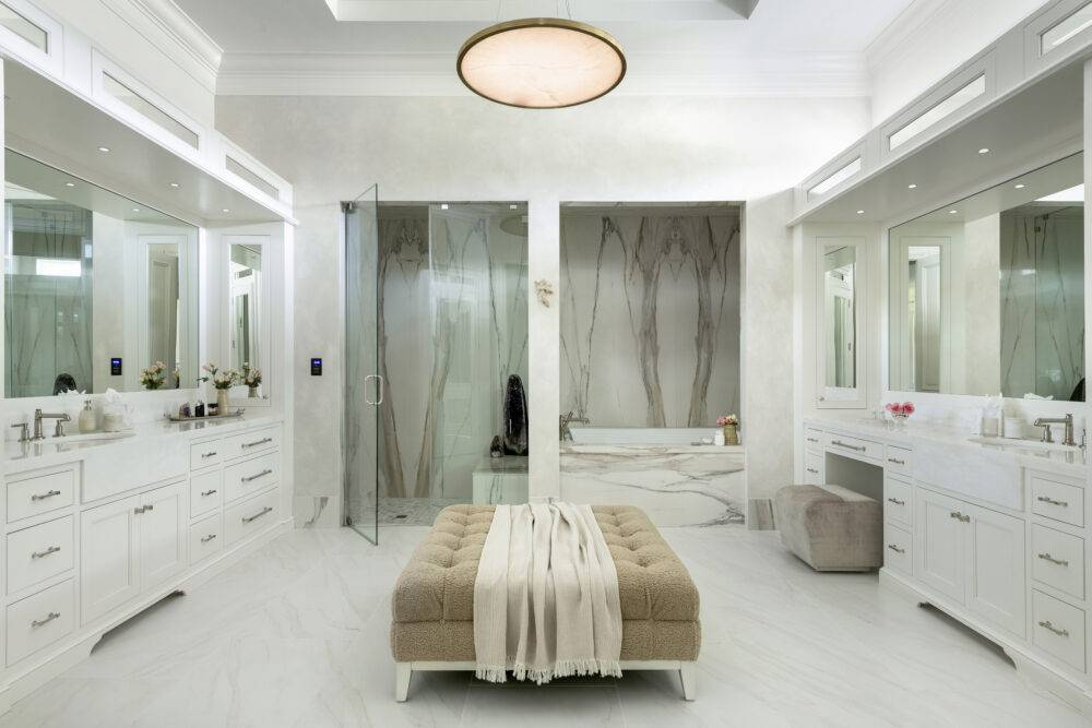 Primary bathroom with seating and countertops. Featuring Tresana Blanco Matte tile. 