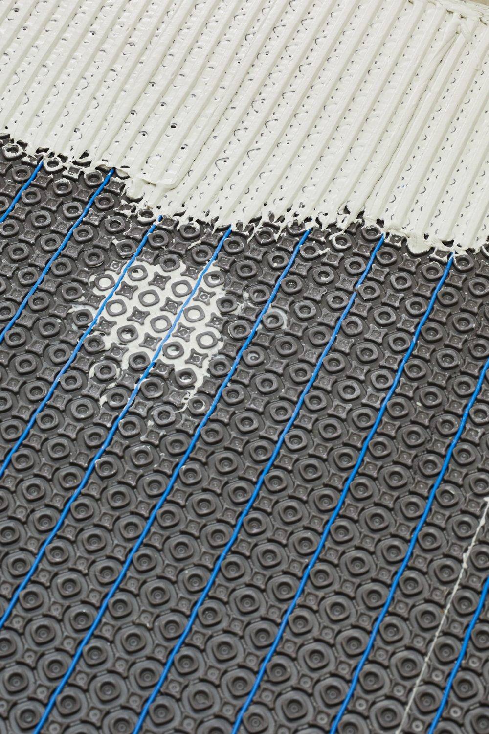 In-floor heat wire in membrane with thinset application