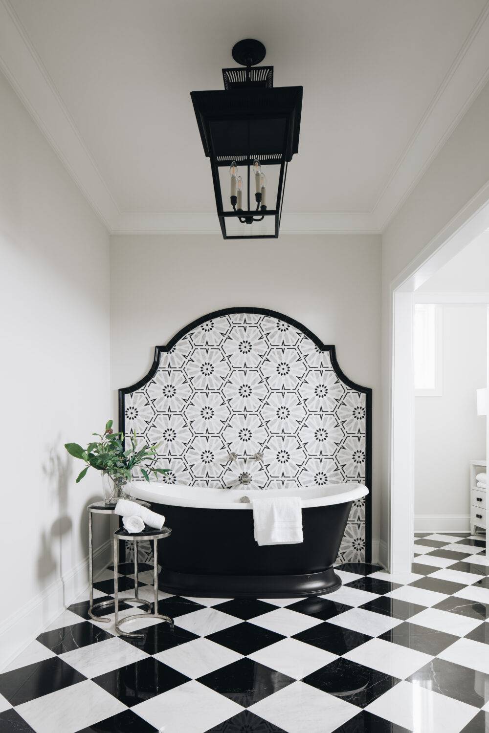 Bathroom with black and white marble checkerboard floor and Casablanca Mosaic wall tile. Featuring Hampton Carrara and Black Marquina.